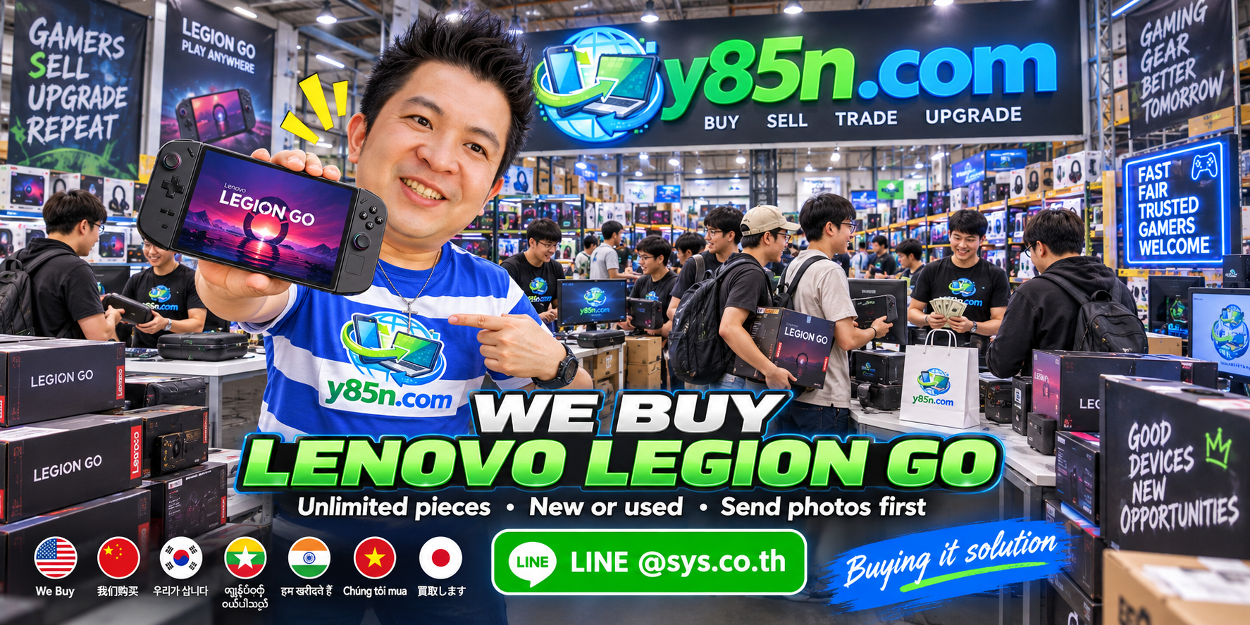 Y85N.com staff and customers evaluating Lenovo Legion Go gaming handhelds in a busy technology warehouse